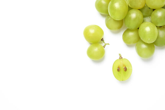 Fresh ripe green grapes on white background, top view