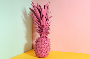 Pink pineapple on color background. Creative concept
