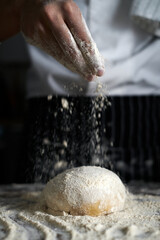 Pastry bakery chef in the kitchen preparing Bread dough. bakery and food concept.