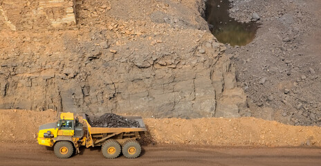Mining dump truck transporting manganese - manganese mining and processing in South Africa