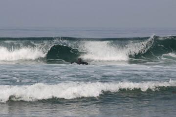 Surfing the wave, diving into the waves