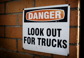 Fototapeta na wymiar Look out for trucks warning danger sign