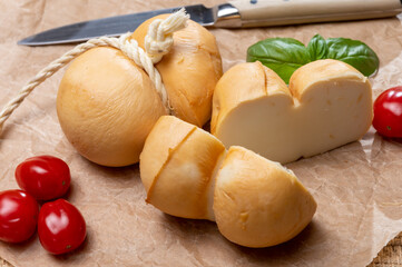 Italian semi hard handmade smoked scamorza cheese, from cow milk from Apulia or Calabria regions