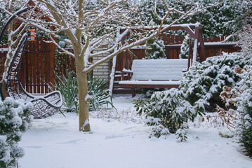 swing in the garden covered with snow 