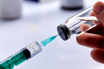  Vaccine in vial with syringe