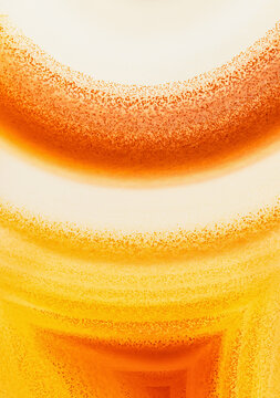 Macro photograph of the speckled appearance of bands in a backlit agate