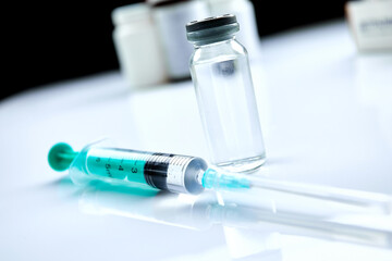  Vaccine in vial with syringe