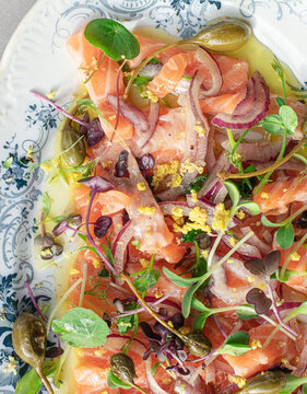 Tasty Salmon Sashimi Carpaccio Salad with Capers and Onion