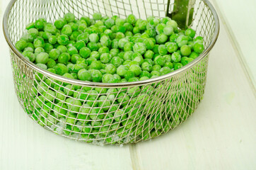 Preservation of vitamins. Frozen green peas. Organic vegetables. Studio Photo