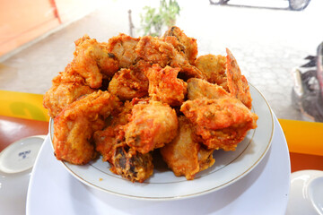 Delicious seasoned fried chicken on a padang restaurant