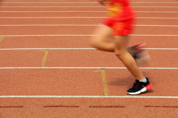 Long distance runners are running on the track