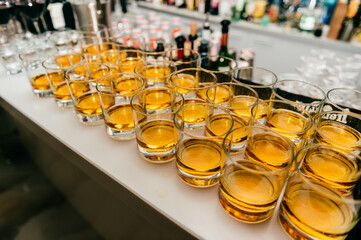 Glasses with alcohol on the bar counter in the nightclub