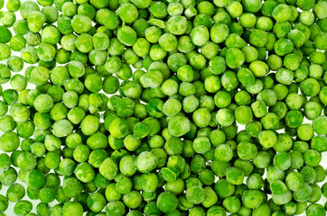Pile of frozen blanched green peas isolated on white background. Healthy food. Studio Photo