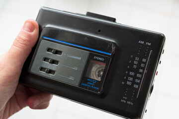 Hand holding a vintage walkman
