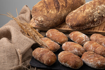 Freshly baked handmade bread with linen textile and dried bents