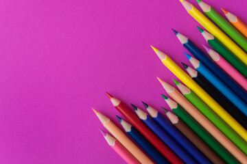 Much colour pencils on the pink background.