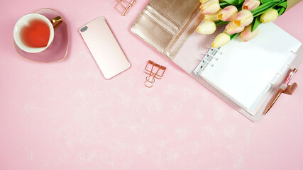 Springtime pink theme desktop workspace with mockups on stylish textured background. Top view blog hero header creative composition flat lay.