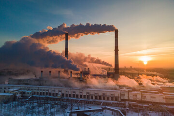 Industrial factory pollution, smokestack exhaust gases. Industry zone, thick smoke. Climate change...