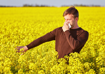 man in rapeseed field.