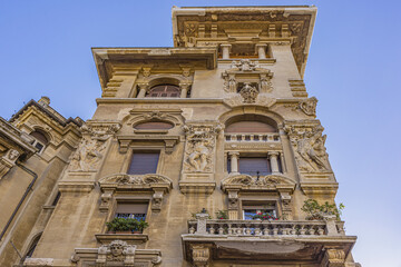 Architectural fragments of Rome Traditional Old house with sculptures in the City Old town. Rome, Lazio, Italy, Europe.