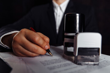 Businessman sign documents in the office. Business concept. Close-up.