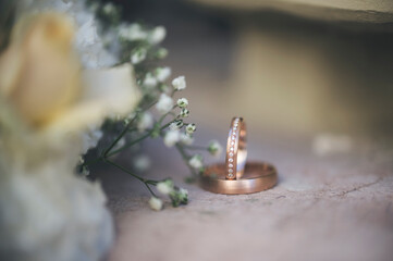 wedding rings and flowers
