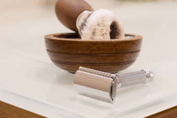 wooden bowl with shaving soap, vegan razor brush and razor
