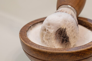 wooden bowl with shaving soap and vegan razor brush