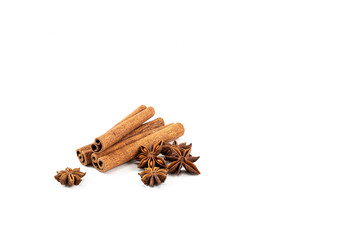 Cinnamon sticks and anise stars on a white background. Flavorings for tea