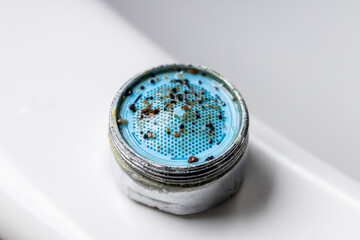 plumber repair faucet concept. unclog dirty clogged faucet aerator or mixer. plumbing conceptual
