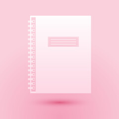 Paper cut Notebook icon isolated on pink background. Spiral notepad icon. School notebook. Writing pad. Diary for business. Office stationery items. Paper art style. Vector.