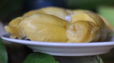 Durian fruit flesh on a white plate