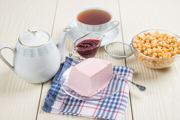 Homemade Aquafaba jelly. Homemade vegan tea party with a self-made dessert on a light background