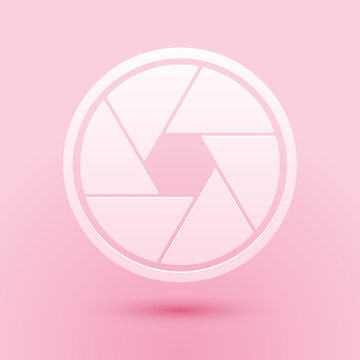 Paper cut Camera shutter icon isolated on pink background. Paper art style. Vector.