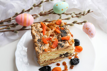 Easter card. traditional Easter cake with raisins, poppy seeds, prunes and dried apricots 