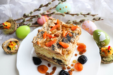 Easter card. traditional Easter cake with raisins, poppy seeds, prunes and dried apricots 