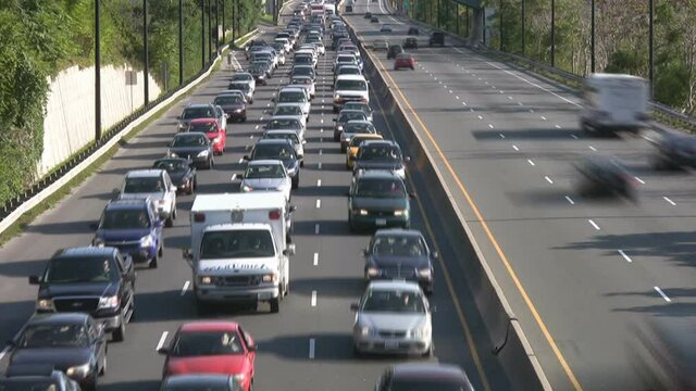 Time lapse of rush hour traffic. Summer evening commuters on the Don Valley Parkway in Toronto, Canada.