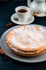 pie with cottage cheese and icing sugar on wooden background, cottage cheese pie