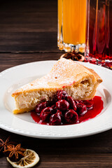 Slices of pie with cottage cheese and icing sugar on wooden background, cottage cheese pie