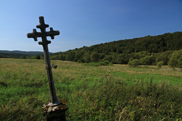 Fototapeta na wymiar Cross on the hill in former village Zubensko, Bieszczady Mountains, Poland