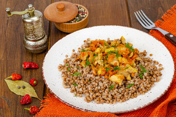 Buckwheat porridge with meat and vegetables. Studio Photo