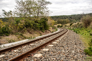Obraz premium Photograph of the railway in the countryside of Sardinia