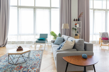 The interior design of the studio apartment in Scandinavian style. A spacious huge room in light colors. stylish expensive luxury furniture.