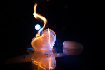 Valentines background. Valentine's Day heart on a dark wooden table. Toned, copy space