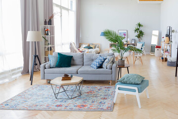 The interior design of the studio apartment in Scandinavian style. A spacious huge room in light colors. stylish expensive luxury furniture.