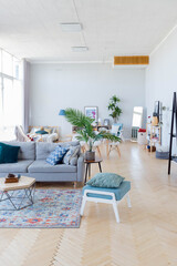 The interior design of the studio apartment in Scandinavian style. A spacious huge room in light colors. stylish expensive luxury furniture.