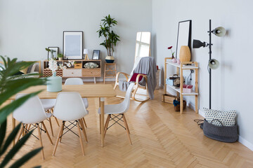 The interior design of the studio apartment in Scandinavian style. A spacious huge room in light colors. stylish expensive luxury furniture.