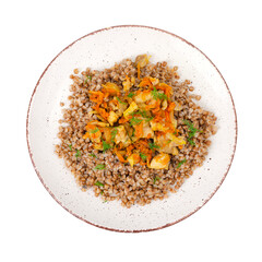 Plate with buckwheat porridge with vegetables and chicken isolated on white background. Studio Photo