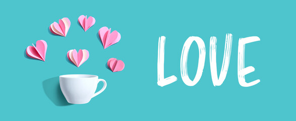 Love message with a coffee cup and paper hearts - flat lay