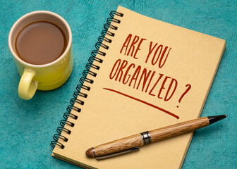Are you organized? Handwriting in a spiral notebook with a cup of coffee. Business, productivity, lifestyle and personal development concept.